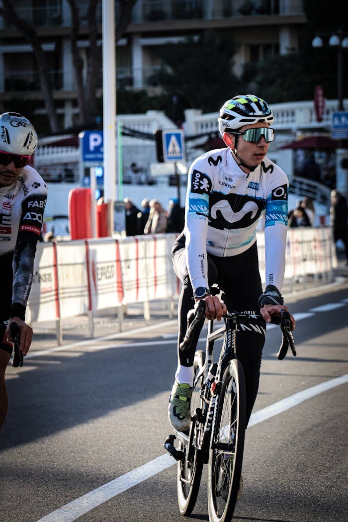 Professional cyclist in action during a competitive street race in the city.